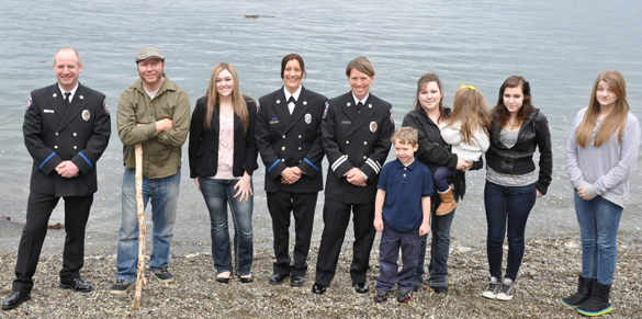 (from left to right) Tacoma fire fighter Jack Hawkins, John Bronson, Rebecca Thayer-Blunt, fire fighter Annie Craig, captain Jennifer Gunnel, and extended family at Owen Beach. (PHOTO COURTESY TACOMA FIRE DEPARTMENT)