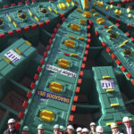 SR 99 Tunnel Project leaders pose in front of Bertha in December 2012. Manufactured in Japan, the five-story-tall machine will begin tunneling beneath Seattle in summer 2013 to replace the waterfront section of the Alaskan Way Viaduct. The tunnel is scheduled to open in late 2015. (PHOTO COURTESY WASHINGTON STATE DEPARTMENT OF TRANSPORTATION)