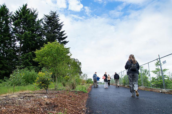 Visitors walked along a recently opened segment of the Pipeline Trail in Tacoma's Salishan neighborhood. (PHOTO COURTESY CITY OF TACOMA)