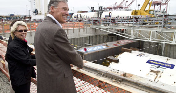 Gov. Jay Inslee and former Gov. Chris Gregoire prepare for a bottle-breaking ceremony Saturday in downtown Seattle to mark the State Route 99 tunneling machine's (nicknamed "Bertha") approaching departure beneath the city. The event drew more than 5,000 people. (PHOTO COURTESY WSDOT)