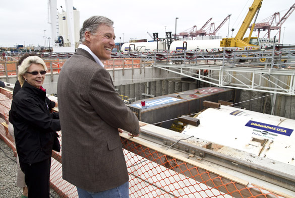 Gov. Jay Inslee and former Gov. Chris Gregoire prepare for a bottle-breaking ceremony Saturday in downtown Seattle to mark the State Route 99 tunneling machine's (nicknamed "Bertha") approaching departure beneath the city. The event drew more than 5,000 people. (PHOTO COURTESY WSDOT)
