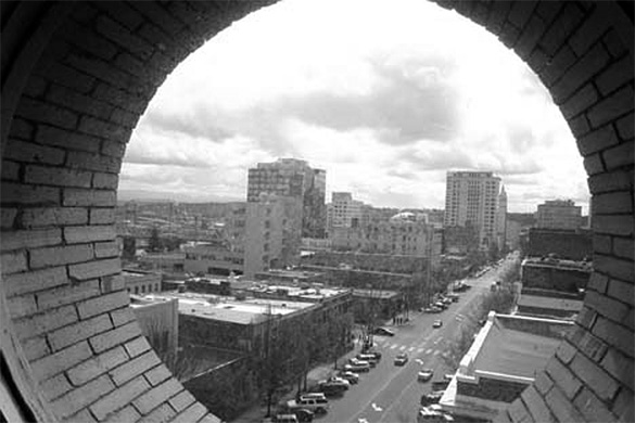Old City Hall in downtown Tacoma, which was built in 1893 has faced foreclosure, was damaged by a fire set by a transient, was deemed ‘derelict’ by city inspectors, and was listed as ‘endangered’ by a local historic preservation group. A view of downtown Tacoma from inside the building. (FILE PHOTO BY TODD MATTHEWS)