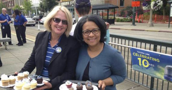 Pierce County Executive Pat McCarthy (left) and Tacoma Mayor Marilyn Strickland (right) greeted Link light rail riders at Union Station Thursday with free treats from Hello, Cupcake in downtown Tacoma.