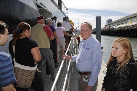 Port of Tacoma Budget Manager Al Cleaves welcomes guests onboard the Argosy's Lady Mary for a free boat tour of the Port of Tacoma. (PHOTO COURTESY PORT OF TACOMA)