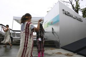 Members of the Puyallup Tribe Canoe Family perform as part of a blessing ceremony Thursday during a groundbreaking ceremony in downtown Tacoma to mark the beginning of a $15.5 million, 16,000-square-foot building expansion and redesign of the Tacoma Art Museum. (PHOTO BY TODD MATTHEWS)