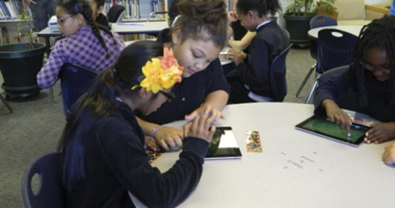 Students and teachers at Jennie Reed Elementary School in Tacoma participate in educational activities at the new iPad Learning Lab. (PHOTO COURTESY JENNIE REED ELEMENTARY SCHOOL)