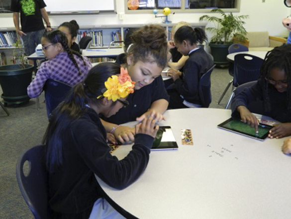 Students and teachers at Jennie Reed Elementary School in Tacoma participate in educational activities at the new iPad Learning Lab. (PHOTO COURTESY JENNIE REED ELEMENTARY SCHOOL)