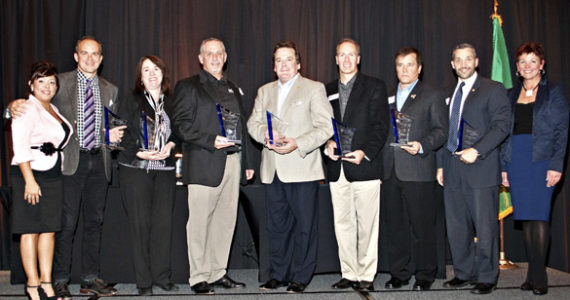 FROM LEFT TO RIGHT: Monique Trudnowski, Emcee, Adriatic Grill Italian Cuisine & Wine Bar; Josh Dunn, South Sound Magazine; Maureen Fife, Tacoma/Pierce County Habitat for Humanity; John Jarman, Summit Strength & Conditioning; Stan Kott, Hotel Murano; Jason Whalen, Eisenhower Carlson; Rick Stevens, GEICO Insurance; Greg Biersack, Burkhart Dental Supply; and Carlyn Roy, TAPCO Credit Union were among the award recipients and sponsors during The 2013 "Spotlight! On Business Awards" ceremony Friday in downtown Tacoma. (PHOTO COURTESY TACOMA-PIERCE COUNTY CHAMBER)