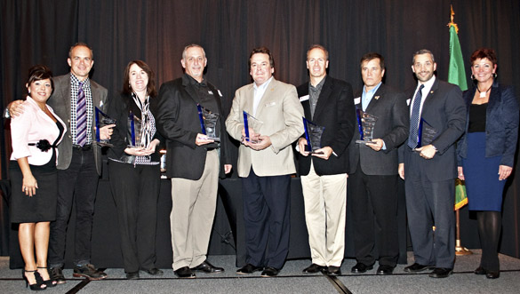 FROM LEFT TO RIGHT: Monique Trudnowski, Emcee, Adriatic Grill Italian Cuisine & Wine Bar; Josh Dunn, South Sound Magazine; Maureen Fife, Tacoma/Pierce County Habitat for Humanity; John Jarman, Summit Strength & Conditioning; Stan Kott, Hotel Murano; Jason Whalen, Eisenhower Carlson; Rick Stevens, GEICO Insurance; Greg Biersack, Burkhart Dental Supply; and Carlyn Roy, TAPCO Credit Union were among the award recipients and sponsors during The 2013 "Spotlight! On Business Awards" ceremony Friday in downtown Tacoma. (PHOTO COURTESY TACOMA-PIERCE COUNTY CHAMBER)