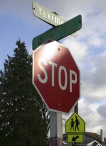 Street signs at the corner of North 13th Street and Yakima Avenue will soon be replaced to honor the late principal of Lowell Elementary School. (PHOTO BY TODD MATTHEWS)