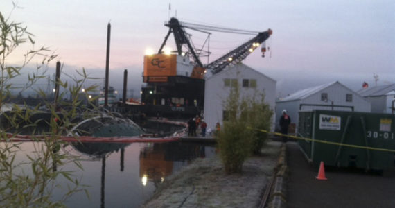 A 700-ton crane barge arrived on the Hylebos Waterway in Tacoma early Thursday morning to prepare to lift the 167-foot derelict vessel Helena Star, which sank at the old Mason Marine location on Jan. 25. (PHOTO COURTESY WASHINGTON STATE DEPARTMENT OF NATURAL RESOURCES)