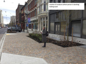 Tacoma Arts Administrator Amy McBride stands where the sculpture will be sited within the historic district. (IMAGE COURTESY CITY OF TACOMA)