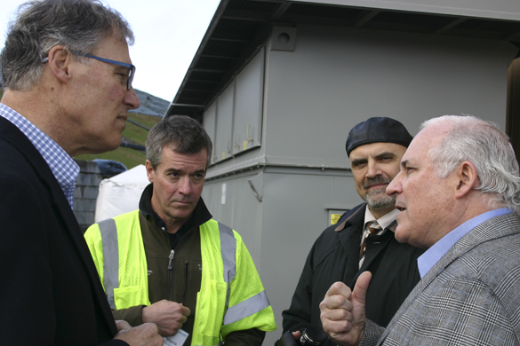 BioFuels Washington Managing Director Frank Mazanec (far right) discusses a new methane gas conversion facility at the LRI Landfill in Pierce County with (from left to right) Washington State Governor Jay Inslee, Waste Connections Division Vice President John Rodgers, and Tacoma City Councilmember David Boe. (PHOTO BY TODD MATTHEWS)