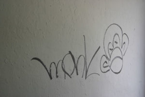 The former Graffiti Garage in downtown Tacoma still has traces of its artistic past. (PHOTO BY TODD MATTHEWS)