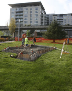 Contractors made final site preparations before concrete was poured Monday morning at the future home of Tacoma's Sun King sculpture. (PHOTO BY TODD MATTHEWS)