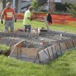 Contractors made final site preparations before concrete was poured Monday morning at the future home of Tacoma's Sun King sculpture. (PHOTO BY TODD MATTHEWS)