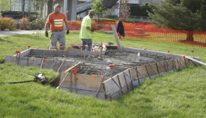 Contractors made final site preparations before concrete was poured Monday morning at the future home of Tacoma's Sun King sculpture. (PHOTO BY TODD MATTHEWS)