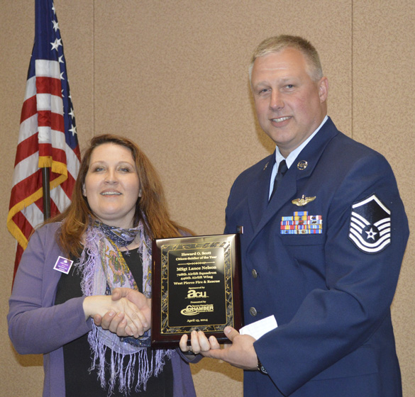 Amy Tiemeyer, Military Relations Liaison at America's Credit Union presented this year's Howard O. Scott Citizen-Soldier of the Year Award to 446th Airlift Wing Master Sergeant Lance Nelson. (PHOTO COURTESY TACOMA-PIERCE COUNTY CHAMBER)