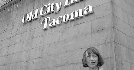 Historic Tacoma board president Sharon Winters outside Old City Hall. "The city is at a very vulnerable time right now," says Winters. "It's a very exciting time for Tacoma, but also a very vulnerable time for the old structures in town." (PHOTO BY TODD MATTHEWS)