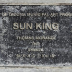 A plaque marks the spot for Tacoma's Sun King in a park near Thea Foss Waterway. (PHOTO BY TODD MATTHEWS)