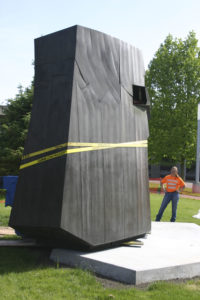 Contractors prepare to place a section of Tom Morandi's Sun King sculpture in a park near Thea Foss Waterway. (PHOTO BY TODD MATTHEWS)