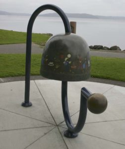 The City of Tacoma recently completed a project to restore the Children's Bell sculpture located along Ruston Way near the shores of Commencement Bay. The four-foot-tall bronze artwork was created in 2000 by artist Larry Anderson in order to celebrate the life, spirit, and accomplishments of Washington PAVE Founder and Director Marty Gentili, who passed away in 1993. The bell is decorated with images of children around the border and is meant to be rung by visitors. In April, area visitors noticed safety barricades were in place around the sculpture while the contractor spent several weeks completing restoration work on the Children's Bell sculpture. (PHOTO BY TODD MATTHEWS)