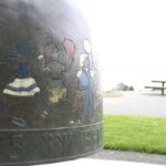 The City of Tacoma recently completed a project to restore the Children's Bell sculpture located along Ruston Way near the shores of Commencement Bay. The four-foot-tall bronze artwork was created in 2000 by artist Larry Anderson in order to celebrate the life, spirit, and accomplishments of Washington PAVE Founder and Director Marty Gentili, who passed away in 1993. The bell is decorated with images of children around the border and is meant to be rung by visitors. In April, area visitors noticed safety barricades were in place around the sculpture while the contractor spent several weeks completing restoration work on the Children's Bell sculpture. (PHOTO BY TODD MATTHEWS)