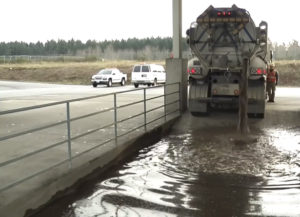 A vactor truck unloads storm drain waste at a decant facility in Pierce County. Processed water is used to wash maintenance trucks, while the solid waste is reused as a soil amendment or transported to a solid waste facility. (PHOTO COURTESY PIERCE COUNTY)