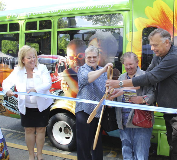 Puyallup Sumner Chamber of Commerce President and CEO Shelly Schlumpf, Pierce Transit CEO Lynne Griffith, an excited member of the public, and Pierce Transit Board Vice-Chair Steve Vermillion cut the ribbon on the new Puyallup Connector Route 425 at the Puyallup Farmers' Market last weekend. (PHOTO COURTESY PIERCE TRANSIT)