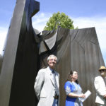 Sculptor Tom Morandi, Tacoma Arts Commission Chair Traci Kelly, and Tacoma City Councilmember David Boe gathered Wednesday in downtown Tacoma to celebrate the installation of Morandi's Sun King sculpture in a public park near Thea Foss Waterway. (PHOTO BY TODD MATTHEWS)