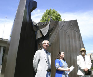 Sculptor Tom Morandi, Tacoma Arts Commission Chair Traci Kelly, and Tacoma City Councilmember David Boe gathered Wednesday in downtown Tacoma to celebrate the installation of Morandi's Sun King sculpture in a public park near Thea Foss Waterway. (PHOTO BY TODD MATTHEWS)
