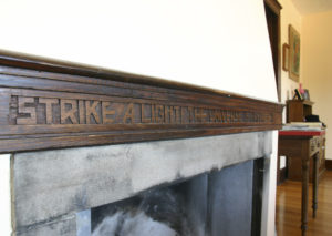 The Shaw House fireplace features the hand-carved inscription, 'Strike A Light! The Universe Is Fireproof!' —  a reference to the poet and editor James Russell Lowell. Beyond architecture, Stanley and his wife, Clara, were active members of several civic organizations. They helped to organize local Quaker meetings, and supported the NAACP, Tacoma YWCA, and the American Friends Service Committee.  (PHOTO COURTESY SUSAN JOHNSON / ARTIFACTS CONSULTING)