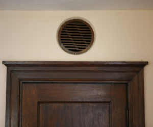 Tacoma architect Stanley Shaw experimented with a number of creative architectural designs in his own home. In the living room, he re-purposed a wooden grille from an old Victrola and installed it above a closet door to provide ventilation for wet coats. (PHOTO COURTESY SUSAN JOHNSON / ARTIFACTS CONSULTING)