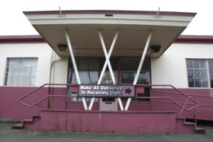 The last days of the former Brown & Haley headquarters and warehouse on the Port of Tacoma tide flats are near. The sprawling, abandoned, and boarded up warehouse near the corner of East 11th Street and Thorne Road was home to the world-famous Tacoma candy maker for more than 40 years. (FILE PHOTO BY TODD MATTHEWS)