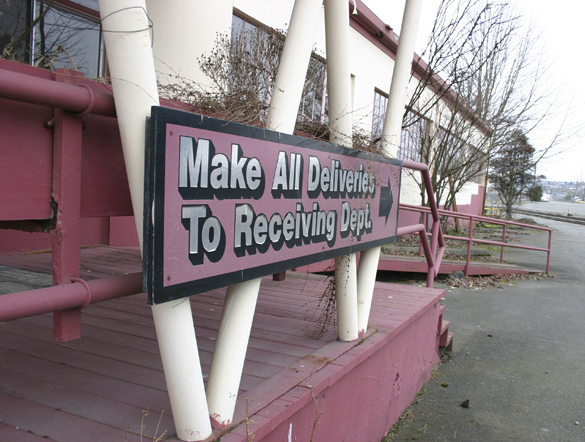 The last days of the former Brown & Haley headquarters and warehouse on the Port of Tacoma tide flats are near. The sprawling, abandoned, and boarded up warehouse near the corner of East 11th Street and Thorne Road was home to the world-famous Tacoma candy maker for more than 40 years. (FILE PHOTO BY TODD MATTHEWS)