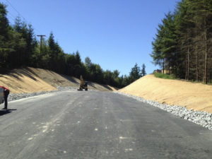 A stretch of 9th Street East, between 190th Avenue East and 198th Avenue East, was reconstructed to enhance safety by re-aligning and regrading the roadway to increase sight distances. The road was closed in June to allow a Pierce County contractor to excavate the site and lay asphalt. The road was re-opened last week, nearly two weeks ahead of schedule. Crews will continue to work along the roadway through September in order to allow crews to complete planting preparation aspects of the project. Periodic lane restrictions are expected during that time. (IMAGE COURTESY PIERCE COUNTY)