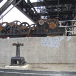 The concrete wall of the stormwater collection system below the western side of Tacoma's Murray Morgan Bridge before Gig Harbor artist Nick Goettling began to pain the mural. (PHOTO COURTESY CITY OF TACOMA)