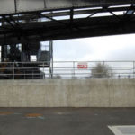 The concrete wall of the stormwater collection system below the western side of Tacoma's Murray Morgan Bridge before Gig Harbor artist Nick Goettling began to pain the mural. (PHOTO COURTESY CITY OF TACOMA)