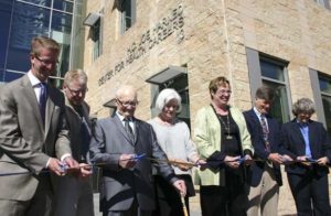 FROM LEFT TO RIGHT: U.S. Congressman Derek Kilmer, Forma Construction Senior Project Manager Mike Rogers, H.C. "Joe" Harned, NBBJ Architects Principal Liz Jacks, Tacoma Community College President Dr. Pamela Transue, Senior Health Policy Advisor to Governor Jay Inslee Dr. Bob Crittenden, and U.S. Representative Laurie Jinkins cut a ceremonial ribbon Thursday to celebrate the grand opening of the H.C. "Joe" Harned Center for Health Careers. (PHOTO BY TODD MATTHEWS)