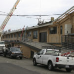 Work is under way to replace the roof on the 104-year-old former Tacoma Municipal Barn in downtown Tacoma. The building was recently added to Tacoma's Register of Historic Places. (PHOTO BY TODD MATTHEWS)