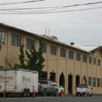 Work is under way to replace the roof on the 104-year-old former Tacoma Municipal Barn in downtown Tacoma. The building was recently added to Tacoma's Register of Historic Places. (PHOTO BY TODD MATTHEWS)