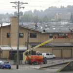 Work is under way to replace the roof on the 104-year-old former Tacoma Municipal Barn in downtown Tacoma. The building was recently added to Tacoma's Register of Historic Places. (PHOTO BY TODD MATTHEWS)