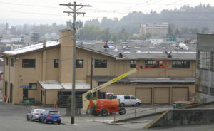 Work is under way to replace the roof on the 104-year-old former Tacoma Municipal Barn in downtown Tacoma. The building was recently added to Tacoma's Register of Historic Places. (PHOTO BY TODD MATTHEWS)