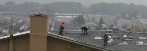 Work is under way to replace the roof on the 104-year-old former Tacoma Municipal Barn in downtown Tacoma. The building was recently added to Tacoma's Register of Historic Places. (PHOTO BY TODD MATTHEWS)