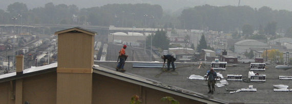 Work is under way to replace the roof on the 104-year-old former Tacoma Municipal Barn in downtown Tacoma. The building was recently added to Tacoma's Register of Historic Places. (PHOTO BY TODD MATTHEWS)