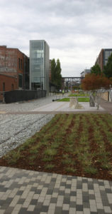 Contractors on Tuesday were putting the finishing touches on a segment of the Prairie Line Trail that runs through the University of Washington Tacoma (UWT) campus. City of Tacoma and UWT officials will celebrate the grand opening of the first phase of the new urban trail during a public ceremony on Thurs., Sept. 25, at 5 p.m. (PHOTO BY TODD MATTHEWS)