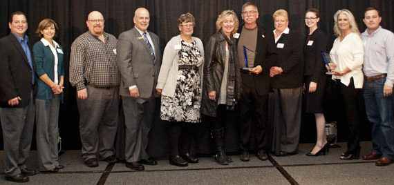 FROM LEFT TO RIGHT: Representatives of AlphaGraphics Tacoma, Stewart & Son Computer Services, Pacific Continental Bank, Power Crews, Kel-Tech Plastics, FISH Food Banks of Pierce County, and Rally Point/6 received 2014 Spotlight! On Business Awards during a luncheon ceremony Wednesday at Hotel Murano in downtown Tacoma. (PHOTO COURTESY TACOMA-PIERCE COUNTY CHAMBER)