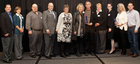 FROM LEFT TO RIGHT: Representatives of AlphaGraphics Tacoma, Stewart & Son Computer Services, Pacific Continental Bank, Power Crews, Kel-Tech Plastics, FISH Food Banks of Pierce County, and Rally Point/6 received 2014 Spotlight! On Business Awards during a luncheon ceremony Wednesday at Hotel Murano in downtown Tacoma. (PHOTO COURTESY TACOMA-PIERCE COUNTY CHAMBER)