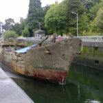 The F/V Helena Star arrives at the Ballard Locks in Seattle in July en route to a scrap facility on Lake Union. (PHOTO COURTESY WASHINGTON STATE DEPARTMENT OF ECOLOGY)