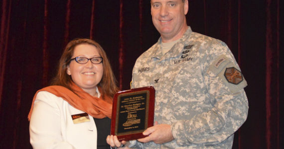 America's Credit Union's Military Relations Liaison Amy Tiemeyer presents the Tacoma-Pierce County Chamber's 35th Annual John H. Anderson Military Citizen of the Year Award to Colonel H. Charles "Chuck" Hodges, Jr. (PHOTO COURTESY TACOMA-PIERCE COUNTY CHAMBER)